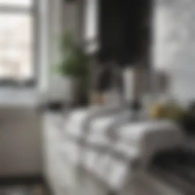 White towels with black stripes displayed in a chic kitchen environment