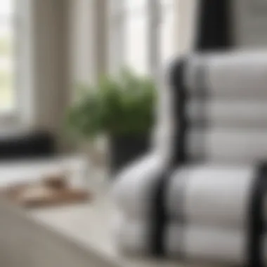 Stylish interior featuring white towels with black stripes on display