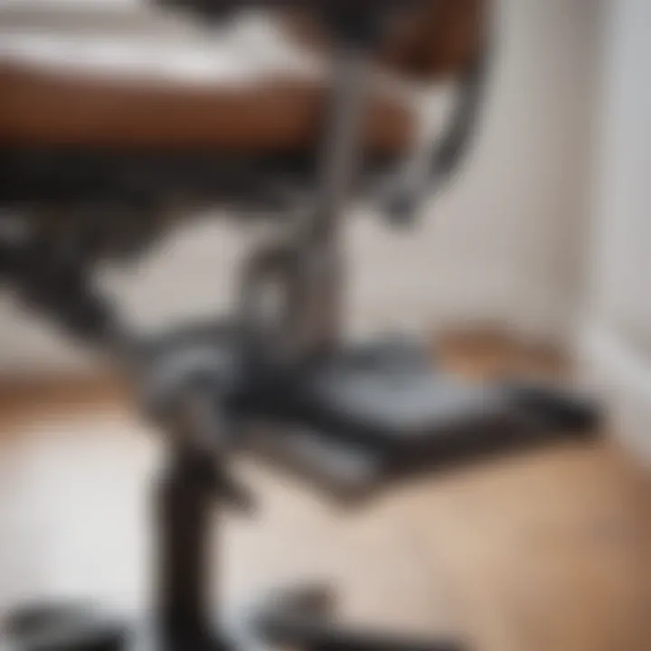 Close-up of adjustable footrest mechanism on task chair